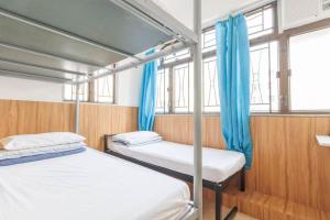 Katil atau katil-katil dalam bilik di Ah Shan Hostel