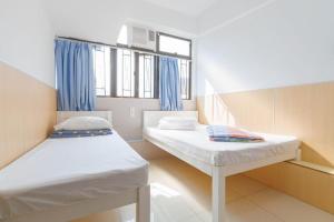 Katil atau katil-katil dalam bilik di Ah Shan Hostel