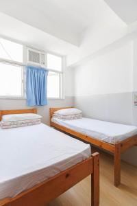 Katil atau katil-katil dalam bilik di Ah Shan Hostel