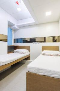 Katil atau katil-katil dalam bilik di Ah Shan Hostel