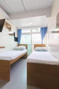 Katil atau katil-katil dalam bilik di Ah Shan Hostel