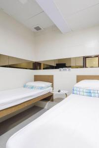 Katil atau katil-katil dalam bilik di Ah Shan Hostel