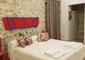Posteľ alebo postele v izbe v ubytovaní Casa Vacanze Brezza di Gaffe