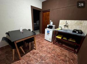 Η κουζίνα ή μικρή κουζίνα στο Mitakunah Departamentos +5 φωτογραφίες