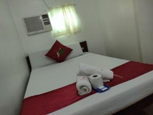 Voodi või voodid majutusasutuse Axis Pension Hotel toas