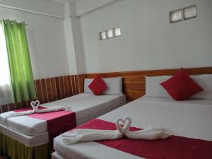 Voodi või voodid majutusasutuse Axis Pension Hotel toas
