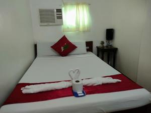 Voodi või voodid majutusasutuse Axis Pension Hotel toas