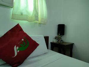 Voodi või voodid majutusasutuse Axis Pension Hotel toas
