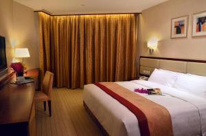 Voodi või voodid majutusasutuse Grandview Hotel Macau toas