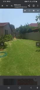 a screenshot of a video of a yard at Den-Away Guesthouse Self Catering Middelburg Mpumalanga in Mhluzi