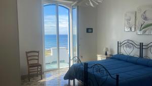 Postel nebo postele na pokoji v ubytování Casa Direttamente sul mare
