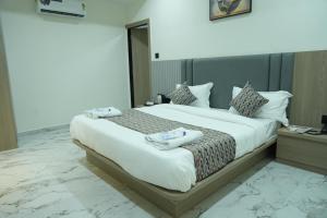 Postel nebo postele na pokoji v ubytování Hotel M Town