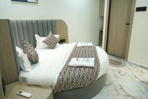 Postel nebo postele na pokoji v ubytování Hotel M Town