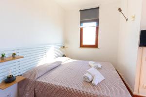 Posteľ alebo postele v izbe v ubytovaní Affitti Brevi Toscana - La Vista sul Porto