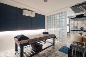 a bedroom with a bed in a room at Tropics Kamala Hill View Studio CTG P613 near Beach and Fantasea in Kamala Beach