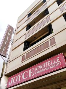 a sign on the side of a building at Joyce Apartelle San Juan in Manila +11 photos