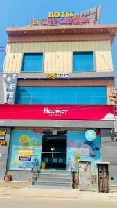 a store front of a hotel with a thermic sign at The Grand's in Jagādhri