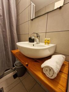 a white sink on a wooden counter in a bathroom at LaCasa Garden in Skiathos Town