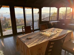 a table in a room with a view of the mountains at Οικία τζιβαέρι in Edessa