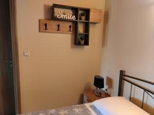 A bed or beds in a room at Silver Pearl Apartment