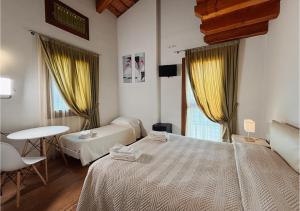 A bed or beds in a room at Agriturismo Vecio Portico