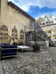 a stone patio in front of a building at Casa Stella in Ameno