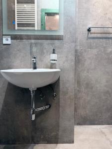 a bathroom with a white sink and a mirror at CARLA comfort stay with 2 bathrooms in Košice +21 photos