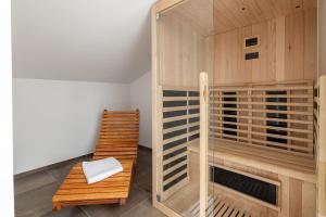 a sauna with a wooden bench and a chair at Villa Betelgeuse Supernova - Happy Rentals in Novi Vinodolski +39 photos