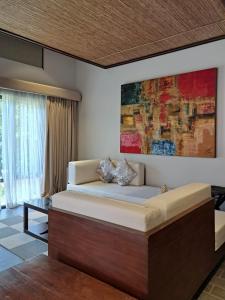 Postel nebo postele na pokoji v ubytování Bacau Bay Resort Coron