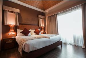 Postel nebo postele na pokoji v ubytování Bacau Bay Resort Coron