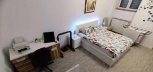 Posteľ alebo postele v izbe v ubytovaní Work and Play Apartment