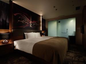Postel nebo postele na pokoji v ubytování Akasaka Granbell Hotel