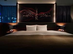 Postel nebo postele na pokoji v ubytování Akasaka Granbell Hotel