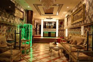 a lobby with a couch and chairs in a room at Tanha Park Hotel in Dubai