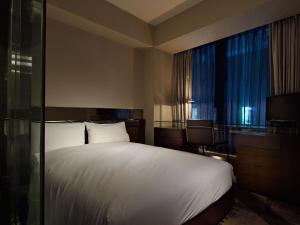 Postel nebo postele na pokoji v ubytování Akasaka Granbell Hotel
