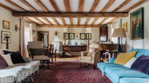 a living room with couches and chairs and a table at A Luxury Tudor Hall & Gardens Located on Breath-Taking Norfolk Estate in Norwich