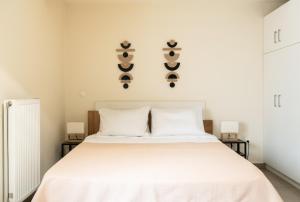 Ένα ή περισσότερα κρεβάτια σε δωμάτιο στο Elysee apartment 2