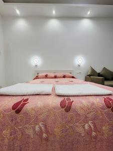 a bedroom with a large bed with a red blanket at Casa Roma in Rome +16 photos
