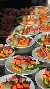 a bunch of plates of food on a table at Isolabella Ayurveda Hotel Hiriketiya in Nilwella