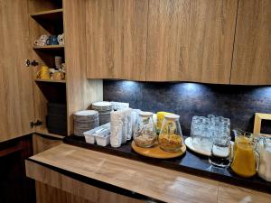 a kitchen counter with jars and glasses on it at Maison de ressourcement évangélique Tabor in Muhlbach-sur-Munster +9 photos