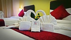 Voodi või voodid majutusasutuse Mirage Hotel Al Aqah toas