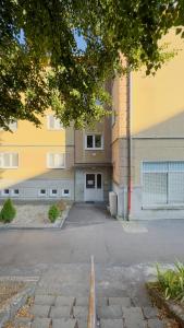 a parking lot in front of a building at apartmán Nataly in Veľký Krtíš