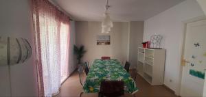 a dining room with a table and a dresser in a room at Casa Chafarinas in Vera +23 photos