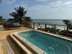 Bazén v ubytování Palafitta Zanzibar nebo v jeho okolí