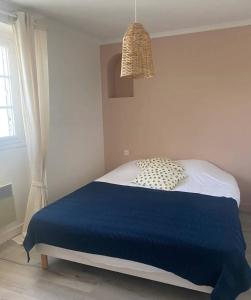 Ένα ή περισσότερα κρεβάτια σε δωμάτιο στο Le dortoir de Marie