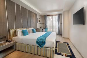 Postel nebo postele na pokoji v ubytování Kathmandu Guest House by KGH Group + 37 fotografií