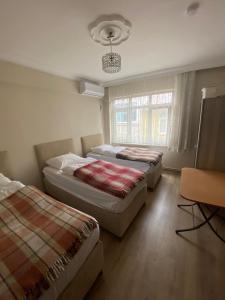 A bed or beds in a room at Yakup's Apartment