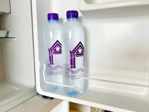 two bottles of water in an open refrigerator at Ayothaya Riverside Hotel in Phra Nakhon Si Ayutthaya