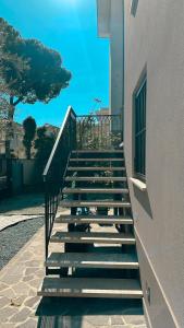 a set of stairs leading up to a building at Serenity Suites Rimini - Affitti Brevi Italia in Rimini
