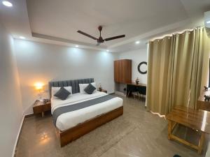 Ένα ή περισσότερα κρεβάτια σε δωμάτιο στο Hotel Breezy Heights